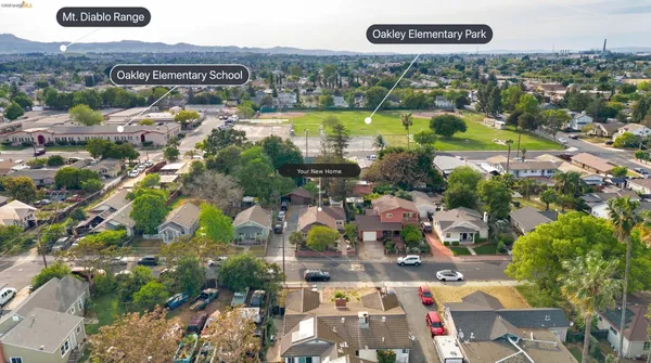 an aerial view of residential houses with outdoor space and river