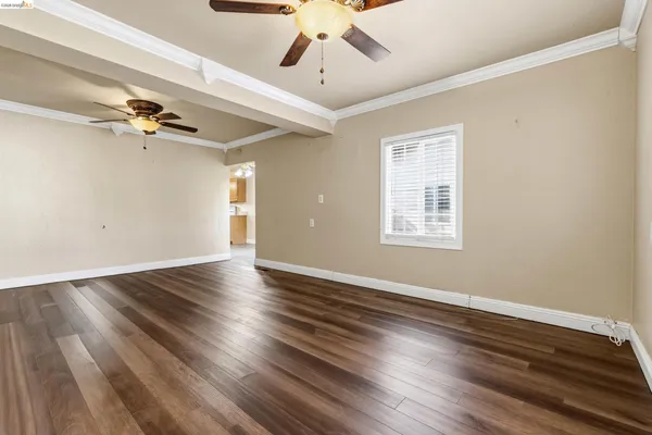 an empty room with windows and entrance