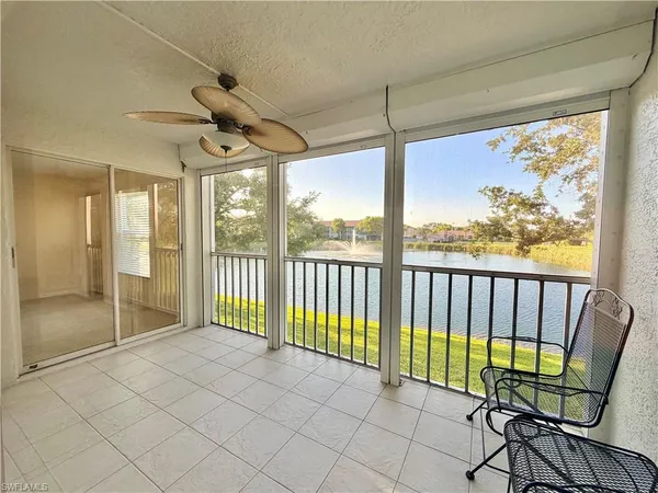 a view of a room with balcony and furniture