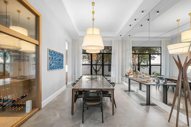 a bedroom with a bed and a couch next to a window