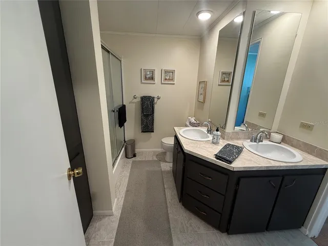 a bathroom with a sink a mirror and a toilet