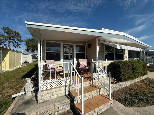 front view of a house with a patio