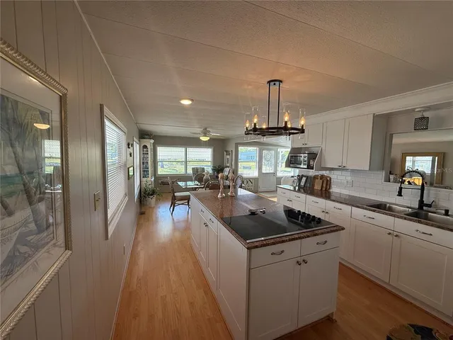 a kitchen with stove and cabinets