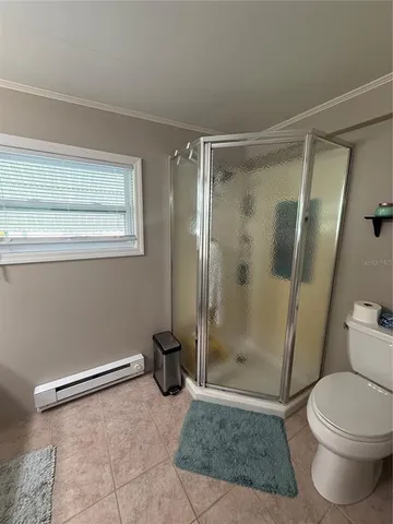 a bathroom with a shower and a toilet