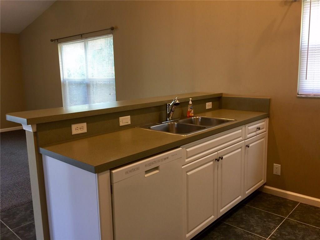 2498 Southwest Regency Road Stuart, FL 34997 - Photo 13 of 47 a kitchen with a sink cabinets and window