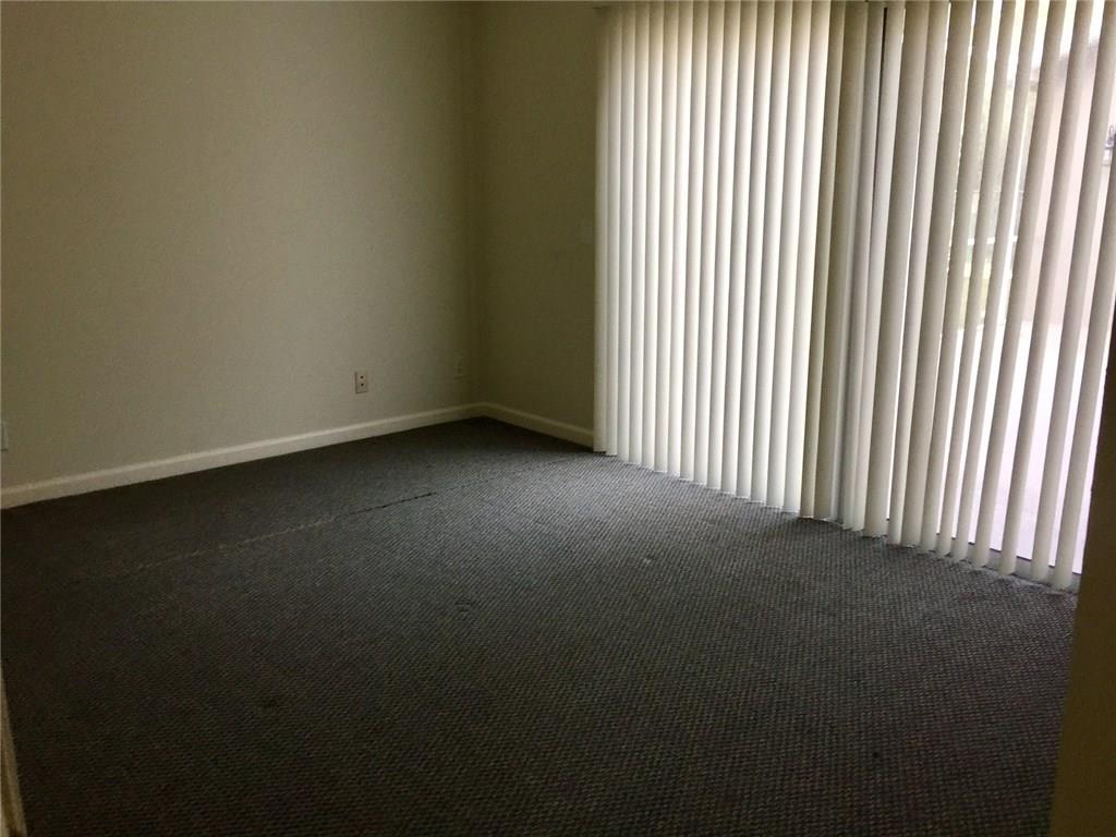 2498 Southwest Regency Road Stuart, FL 34997 - Photo 14 of 47 a view of a room that has a window in it
