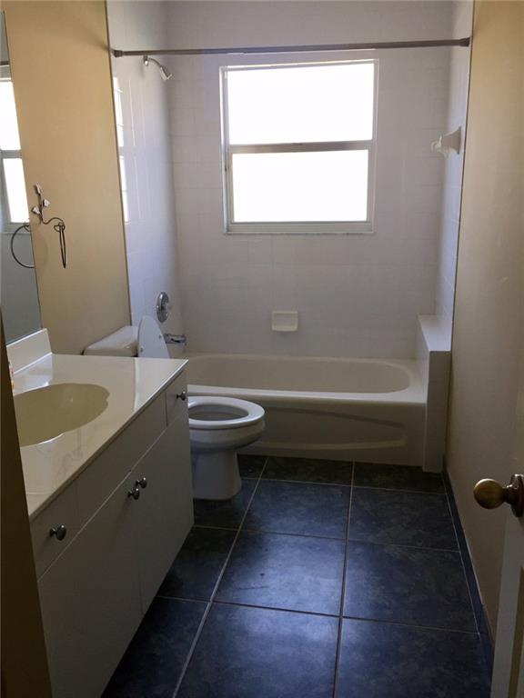 2498 Southwest Regency Road Stuart, FL 34997 - Photo 15 of 47 a bathroom with a sink toilet and shower