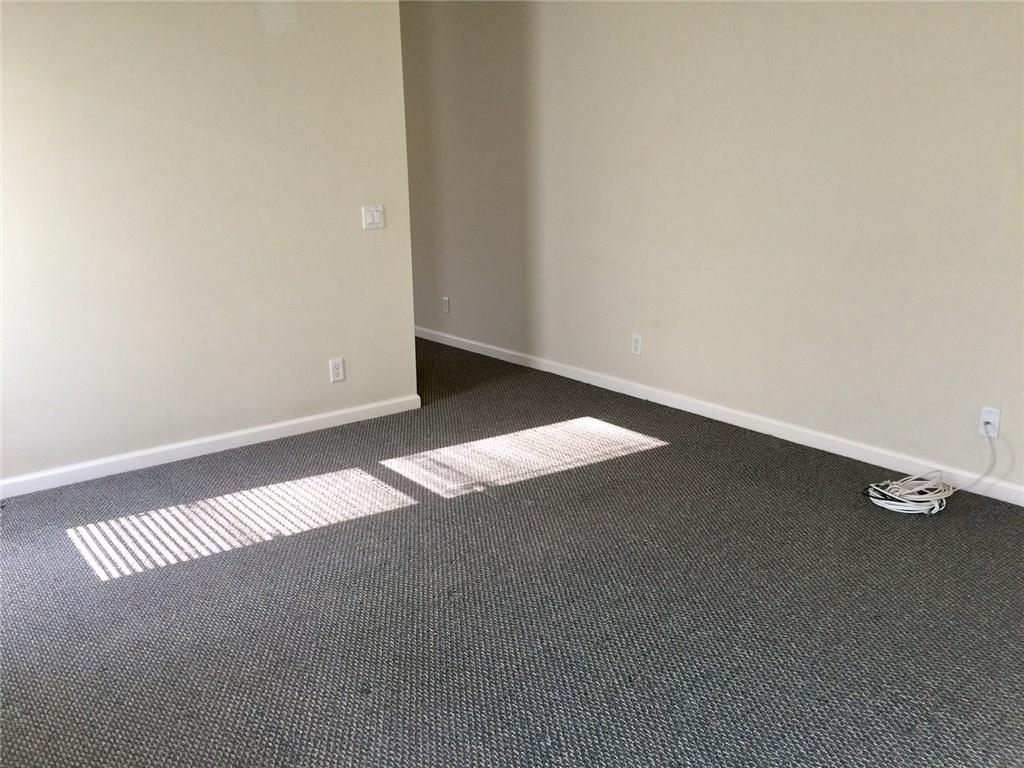 2498 Southwest Regency Road Stuart, FL 34997 - Photo 19 of 47 an empty room with a workbench