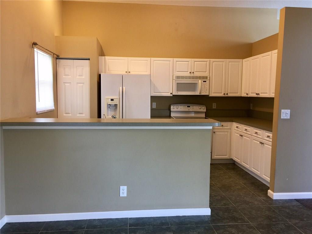 2498 Southwest Regency Road Stuart, FL 34997 - Photo 9 of 47 a view of a kitchen with cabinets