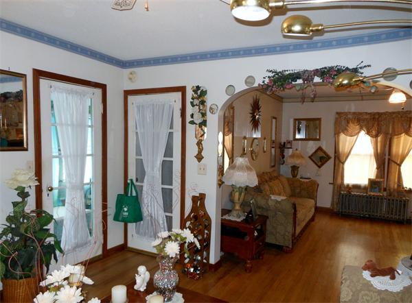 38-40 Jenness Street Springfield, MA 01104 - Photo 12 of 21 a living room with furniture flowers and wooden floor