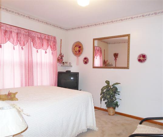 38-40 Jenness Street Springfield, MA 01104 - Photo 13 of 21 a bed room with a bed and a couch