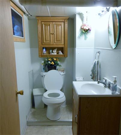 38-40 Jenness Street Springfield, MA 01104 - Photo 17 of 21 a bathroom with a toilet sink and mirror