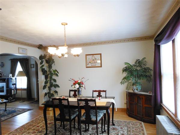 38-40 Jenness Street Springfield, MA 01104 - Photo 5 of 21 a dining room with furniture potted plants and a chandelier