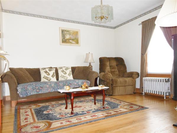 38-40 Jenness Street Springfield, MA 01104 - Photo 6 of 21 a living room with furniture and a rug