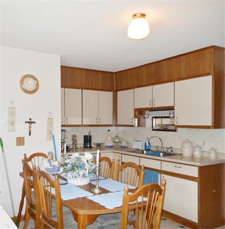 38-40 Jenness Street Springfield, MA 01104 - Photo 10 of 21 a kitchen with stainless steel appliances granite countertop a sink a stove a dining table and chairs