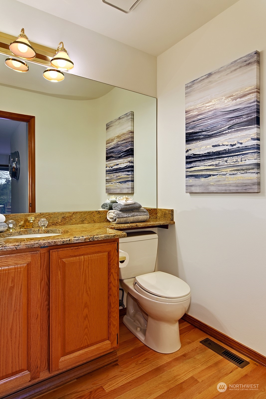 9117 Northeast 151st Street Bothell, WA 98011 - Photo 15 of 31 a bathroom with a granite countertop toilet and a sink
