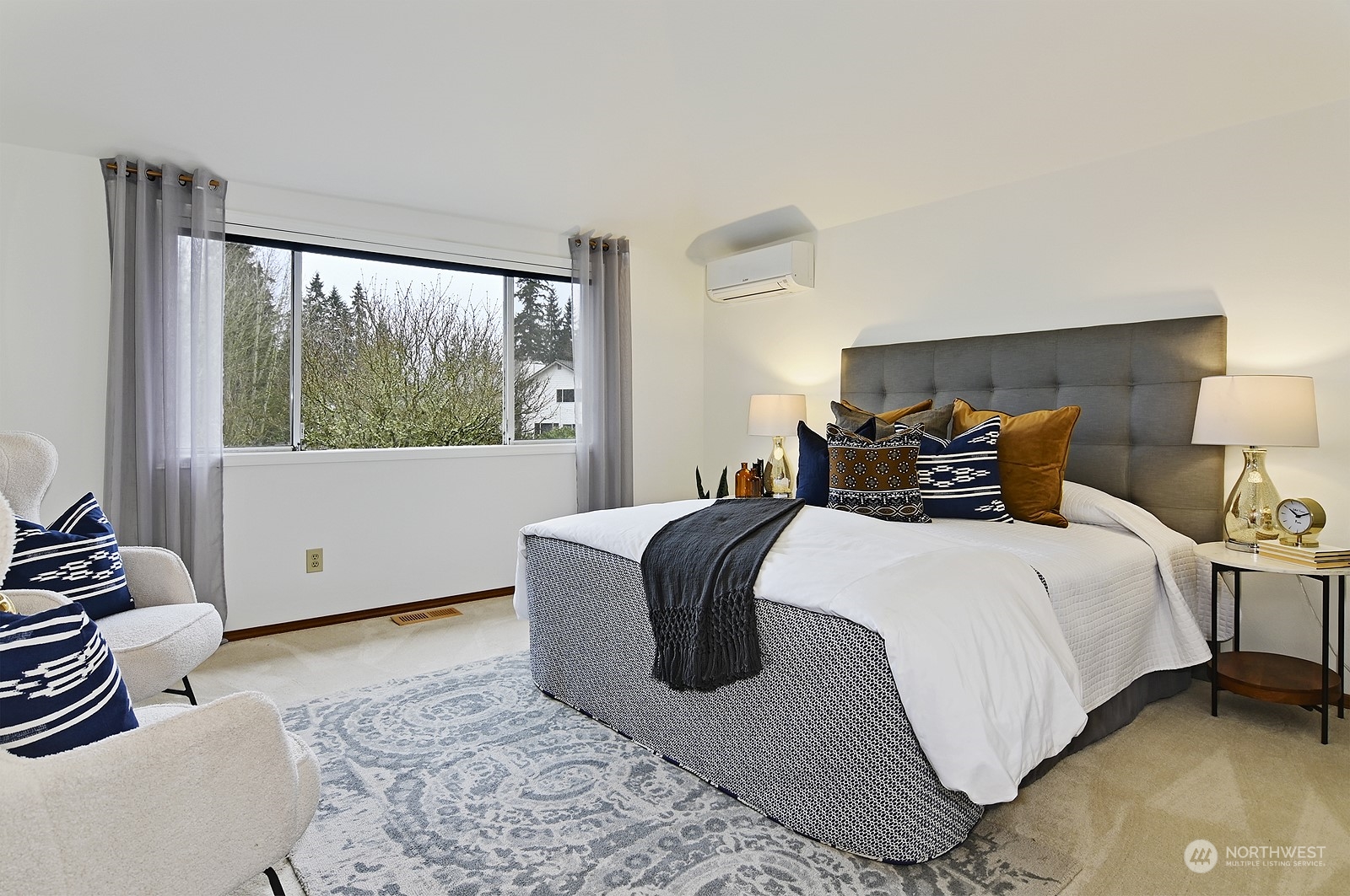 9117 Northeast 151st Street Bothell, WA 98011 - Photo 17 of 31 a bedroom with a bed and wooden floor