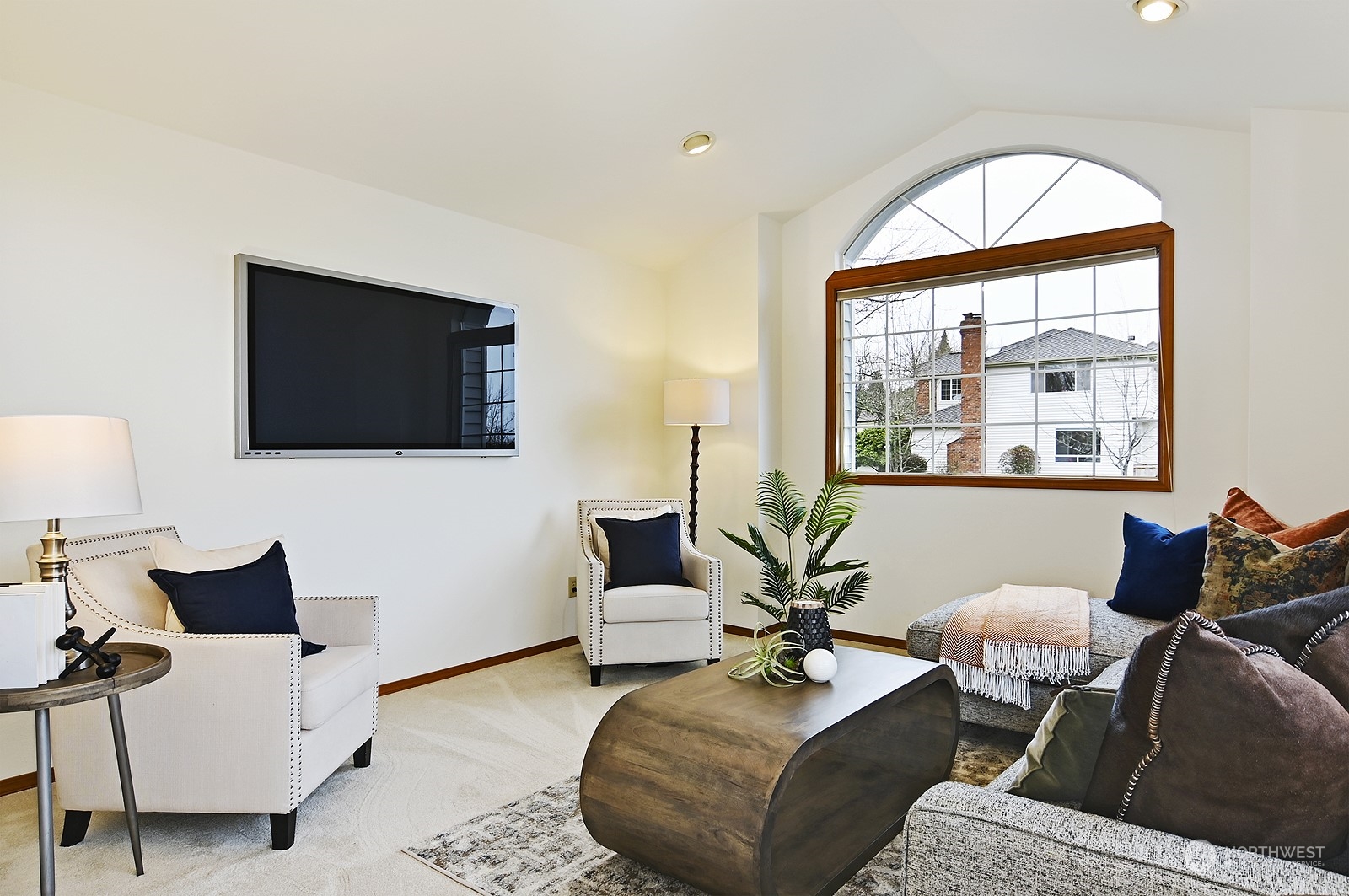 9117 Northeast 151st Street Bothell, WA 98011 - Photo 21 of 31 a living room with furniture and a flat screen tv