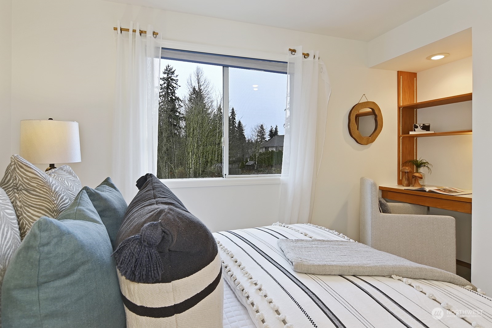 9117 Northeast 151st Street Bothell, WA 98011 - Photo 23 of 31 a bedroom with a bed and a window