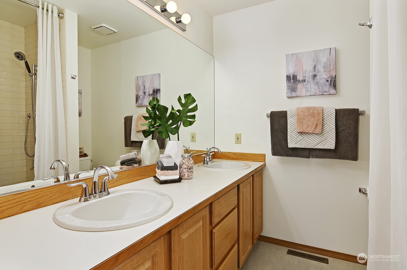 9117 Northeast 151st Street Bothell, WA 98011 - Photo 25 of 31 a bathroom with a sink and a mirror