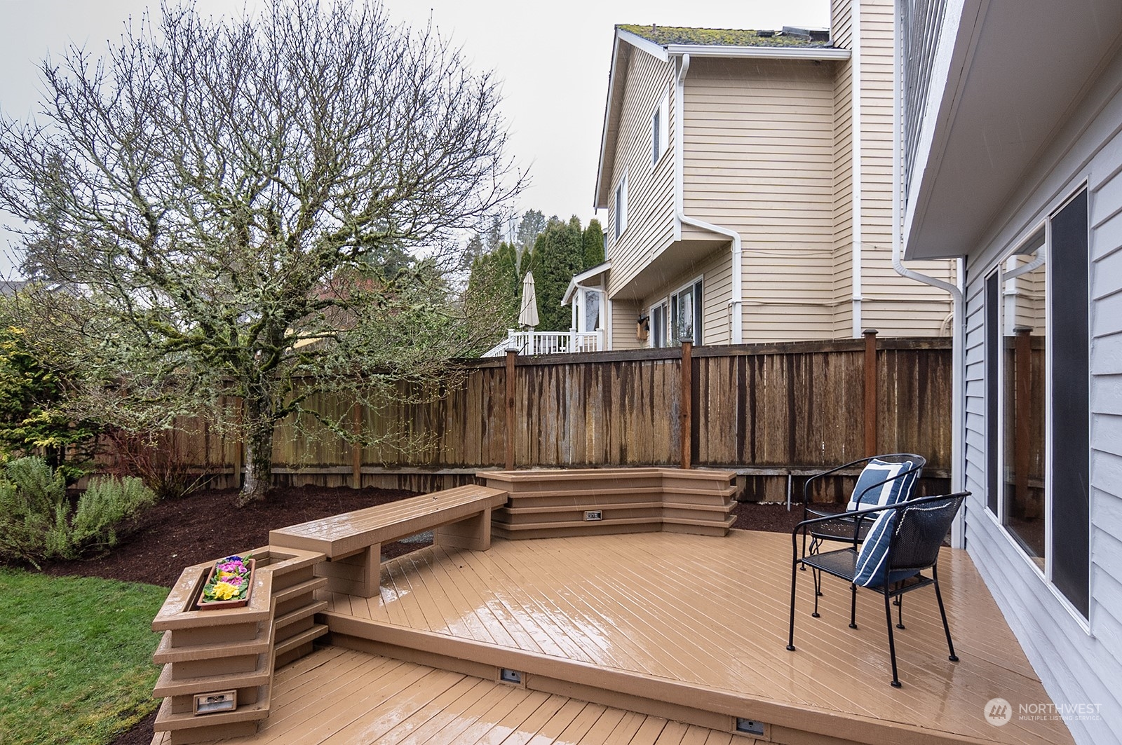 9117 Northeast 151st Street Bothell, WA 98011 - Photo 29 of 31 a view of backyard with seating space and trees