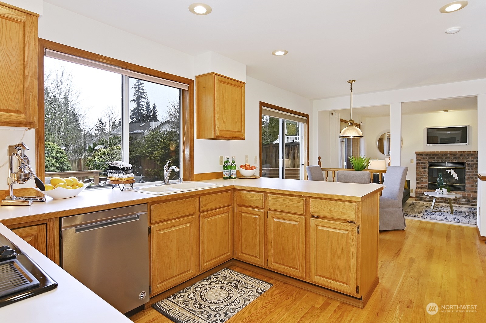 9117 Northeast 151st Street Bothell, WA 98011 - Photo 7 of 31 a kitchen with a sink and cabinets