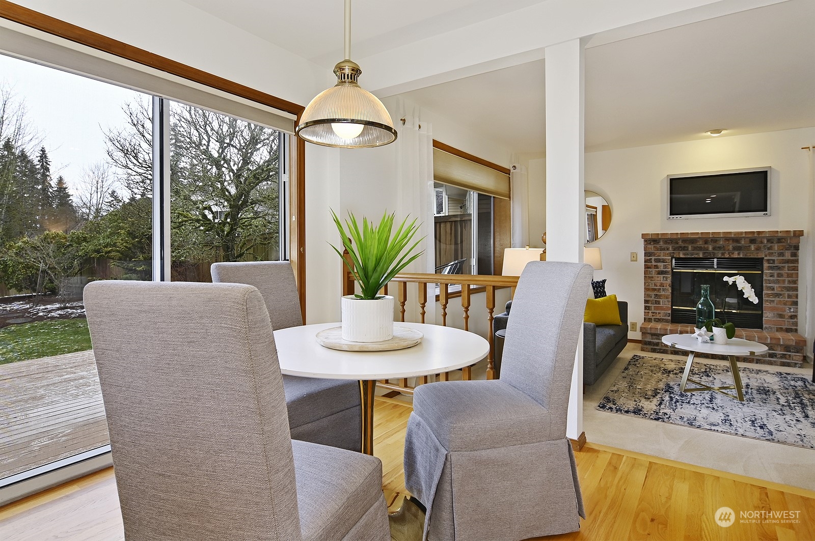 9117 Northeast 151st Street Bothell, WA 98011 - Photo 9 of 31 a view of a dining room with furniture window and wooden floor
