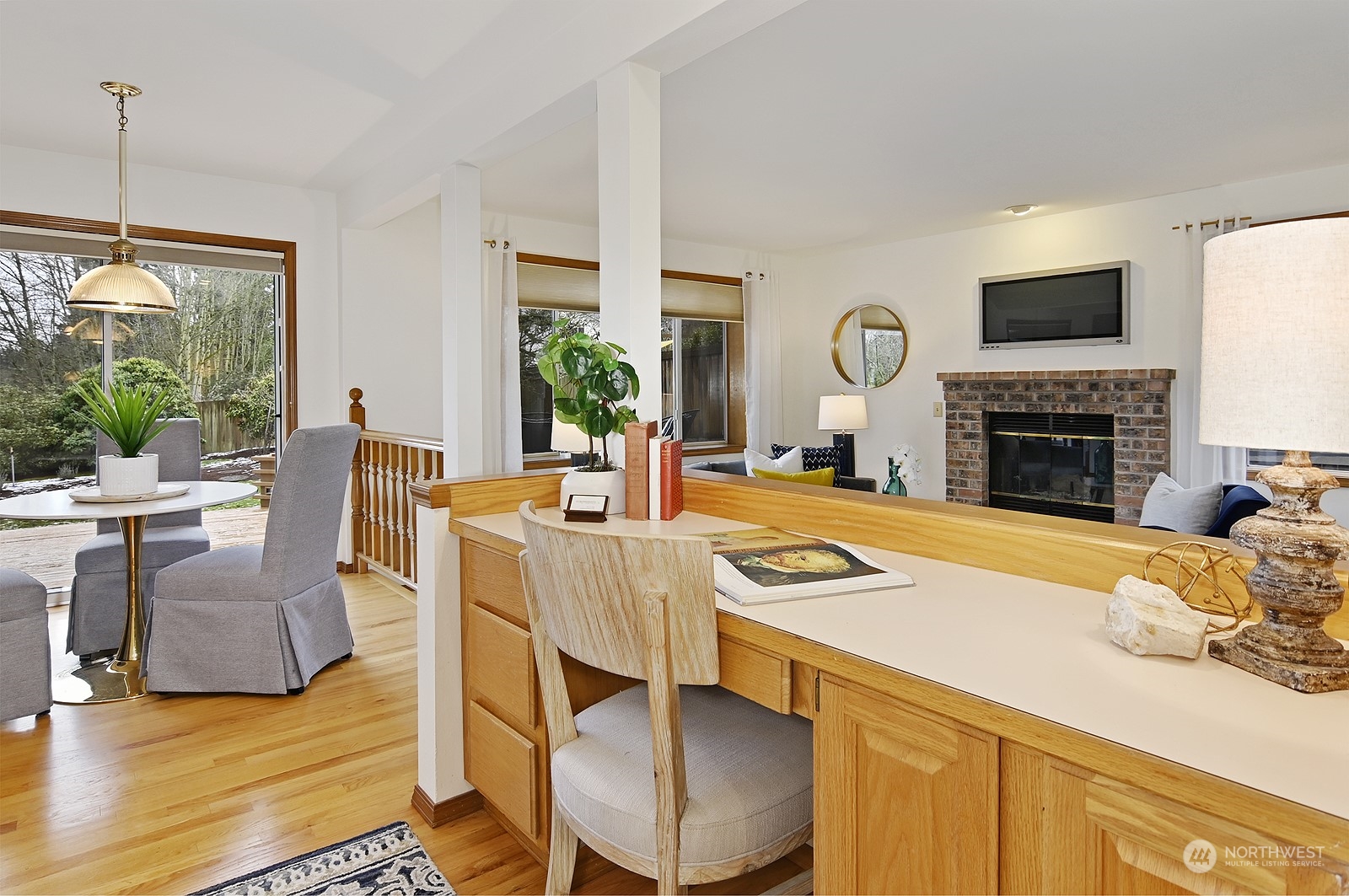 9117 Northeast 151st Street Bothell, WA 98011 - Photo 10 of 31 a view of a dining room with furniture window and wooden floor