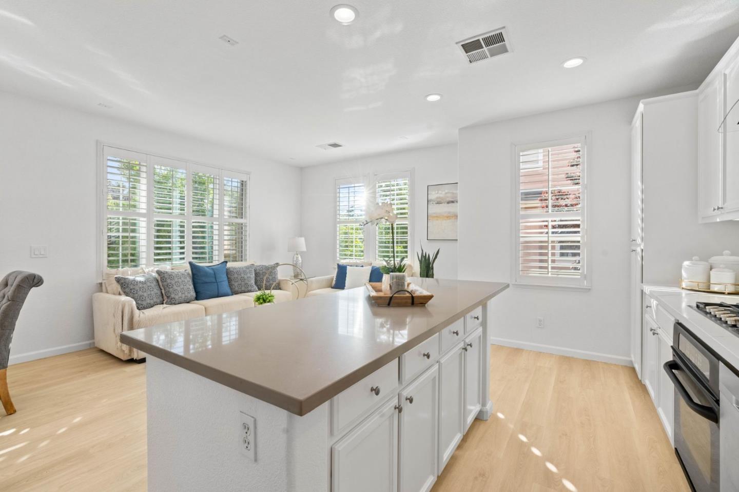 4203 Tobin Circle Santa Clara, CA 95054 - Photo 19 of 51 a open kitchen with stainless steel appliances granite countertop a sink and dishwasher with wooden floor