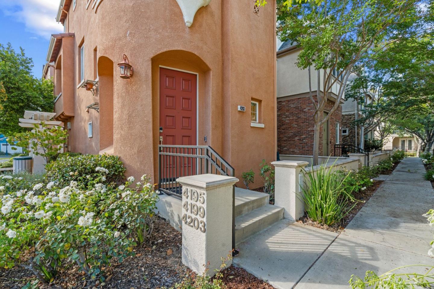 4203 Tobin Circle Santa Clara, CA 95054 - Photo 5 of 51 front view of a brick house with a small yard and large tree
