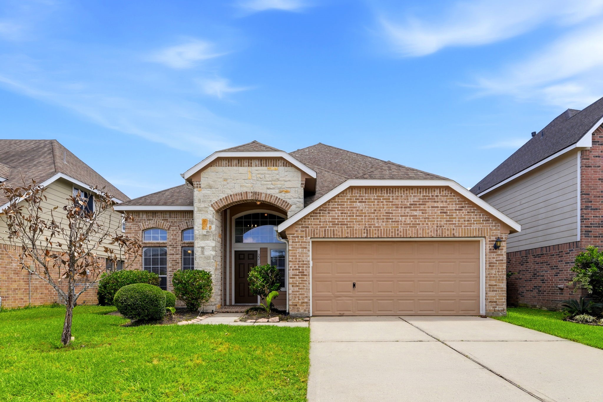 a front view of a house with a yard