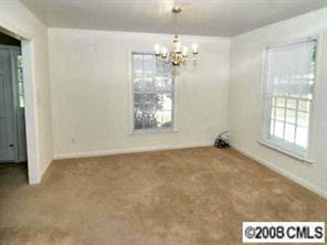 1133 Wimbledon Road Charlotte, NC 28209 - Photo 3 of 8 a view of an empty room with a window