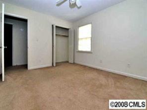 1133 Wimbledon Road Charlotte, NC 28209 - Photo 5 of 8 an empty room with windows and closet