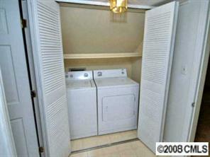 1133 Wimbledon Road Charlotte, NC 28209 - Photo 7 of 8 a utility room with a washer and dryer
