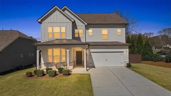 a view of a dining room with furniture and window