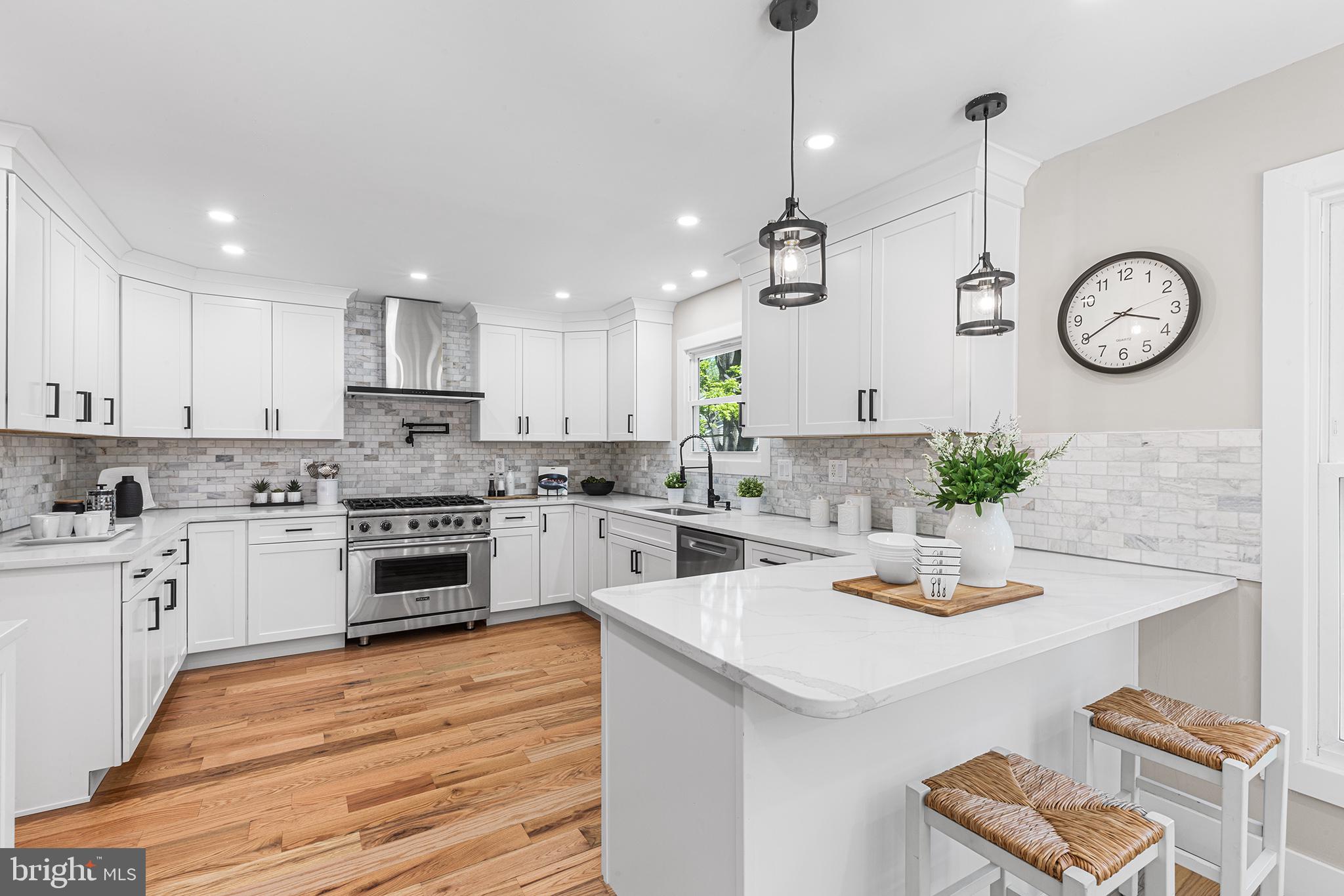 a kitchen with a white stove top oven and cabinets