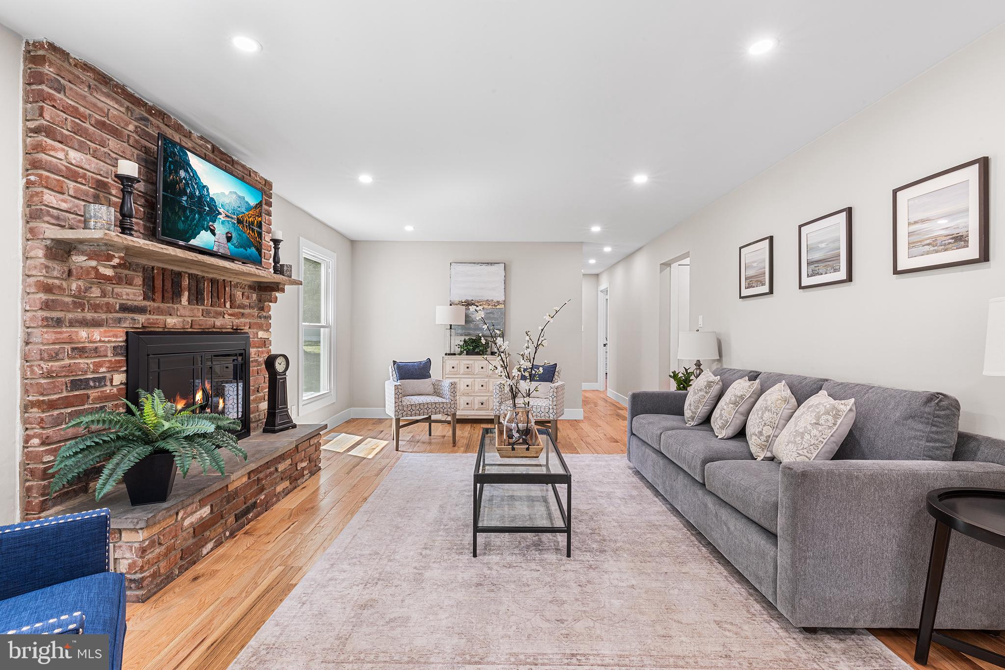 849 Glenn Circle Wayne, PA 19087 - Photo 12 of 36 a living room with furniture and a fireplace