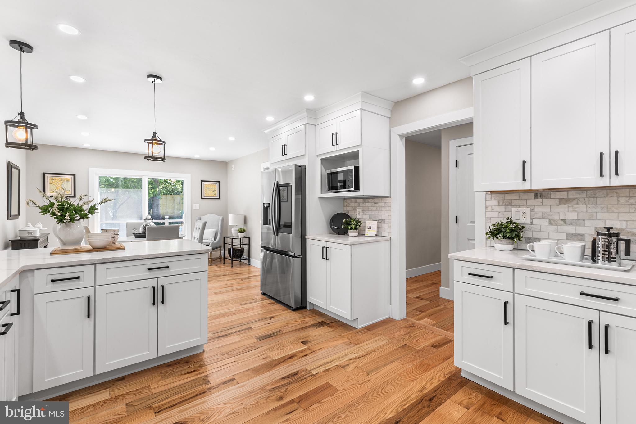 849 Glenn Circle Wayne, PA 19087 - Photo 3 of 36 a kitchen with white cabinets and white appliances