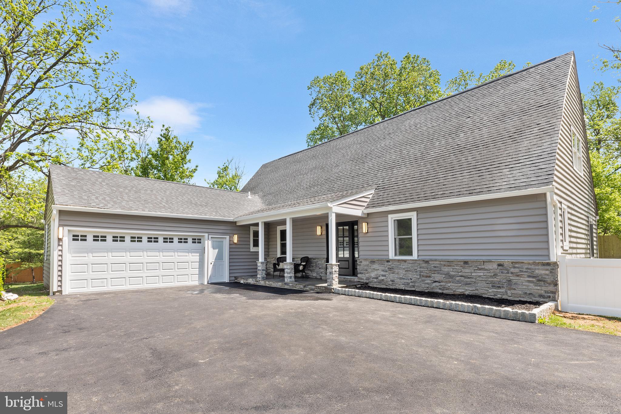 849 Glenn Circle Wayne, PA 19087 - Photo 34 of 36 a front view of a house with a yard and garage