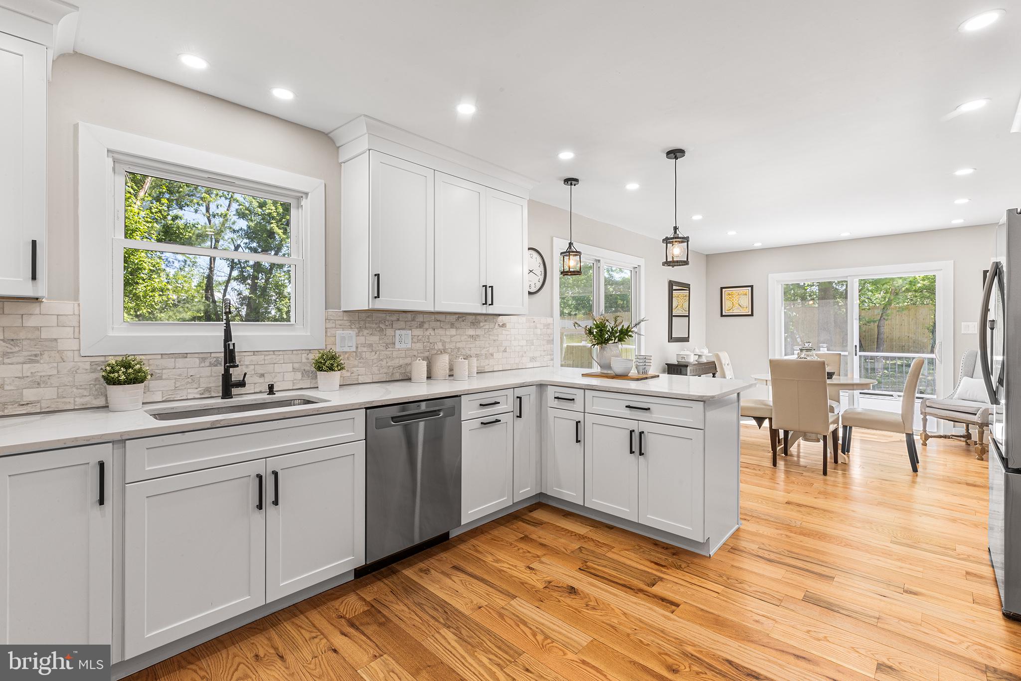 849 Glenn Circle Wayne, PA 19087 - Photo 5 of 36 a kitchen with sink cabinets and wooden floor
