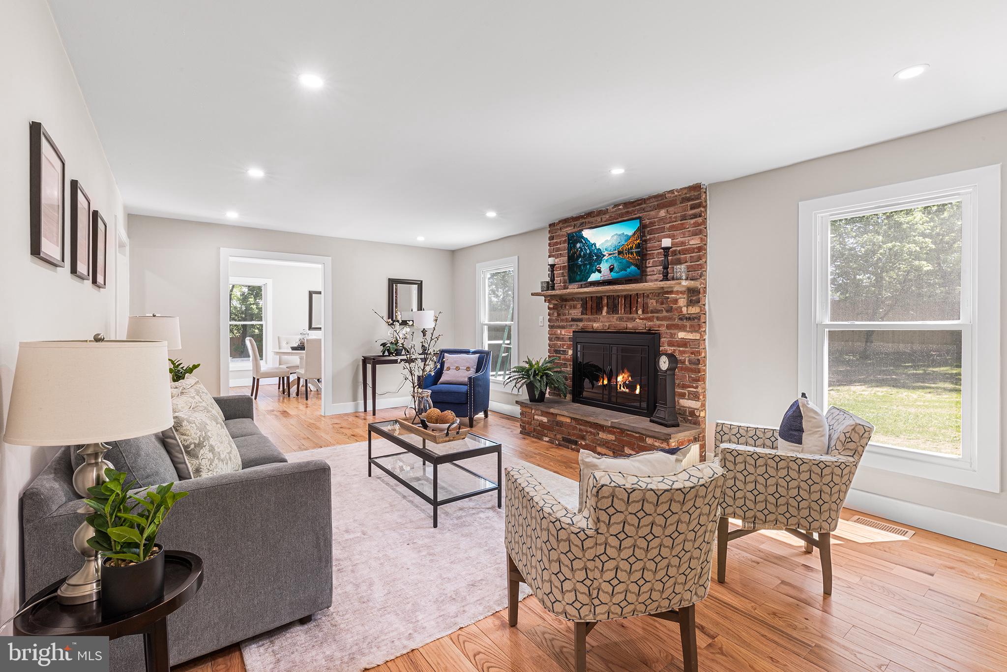 849 Glenn Circle Wayne, PA 19087 - Photo 7 of 36 a living room with furniture and a fireplace