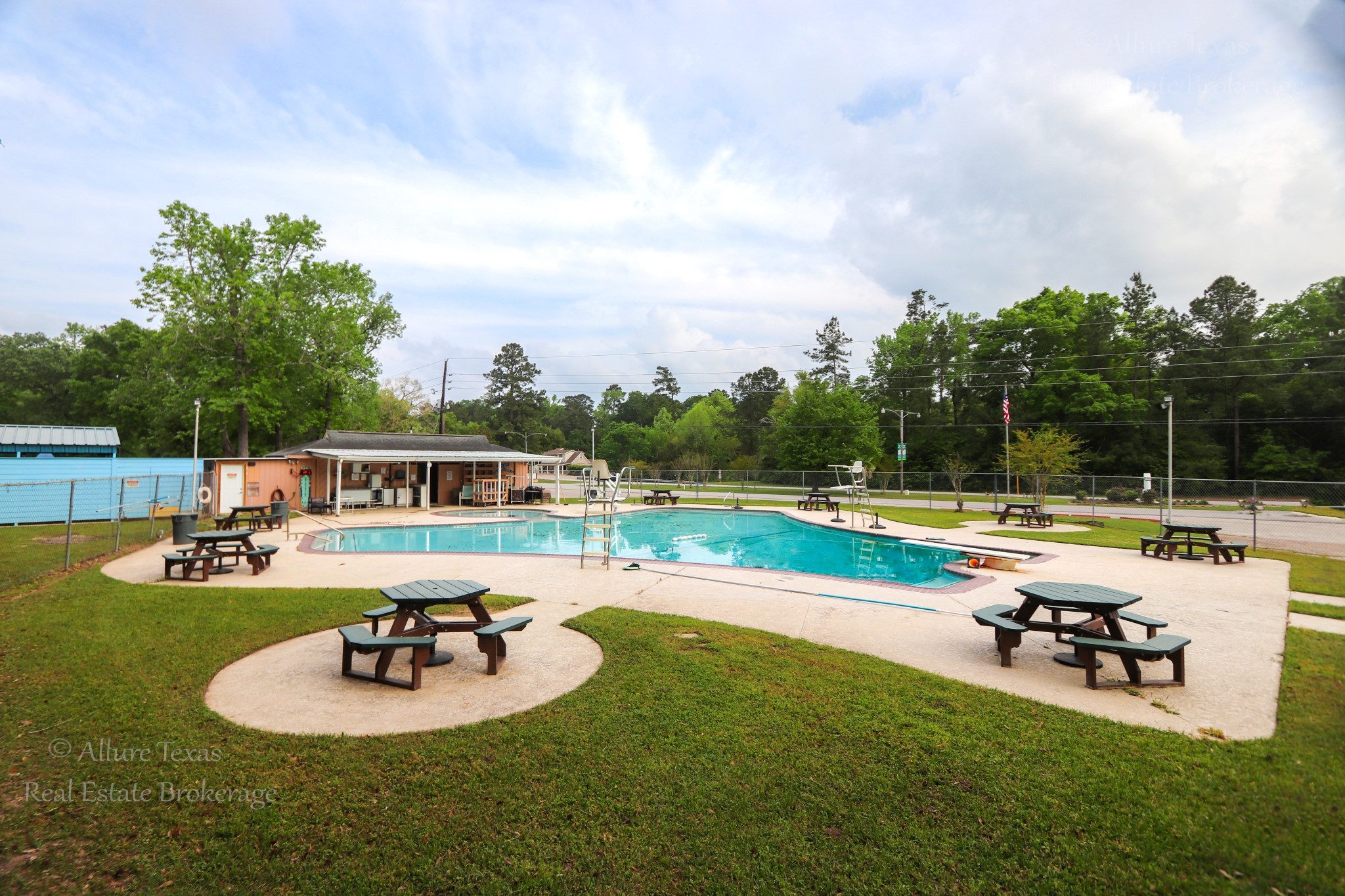 2208 Appian Way New Caney, TX 77357 - Photo 11 of 14 a swimming pool with outdoor seating and barbeque oven