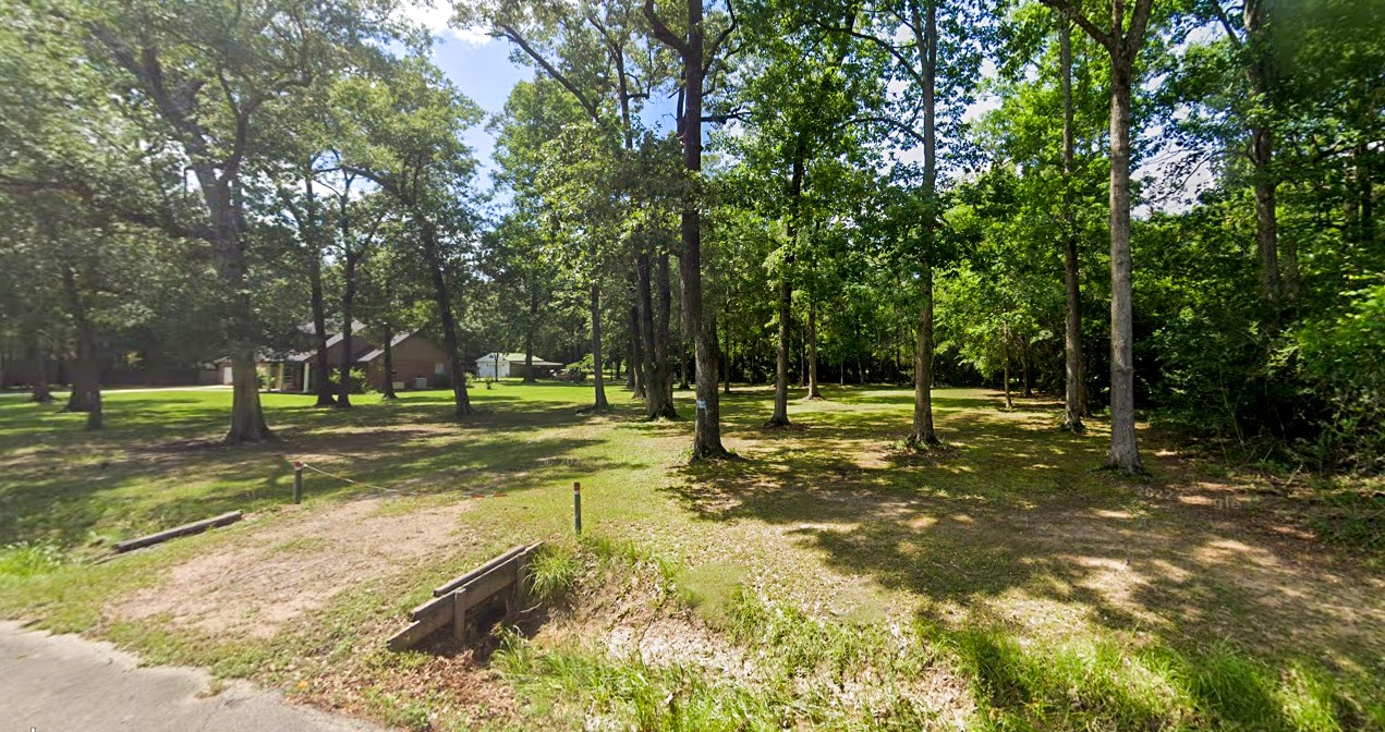 2208 Appian Way New Caney, TX 77357 - Photo 2 of 14 a view of a park with tree s