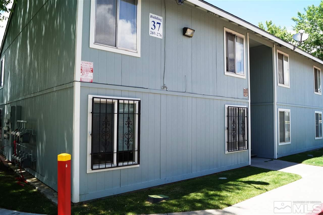 4608 Neil Road, Unit 275 Reno, NV 89502 - Photo 2 of 13 a front view of a house with a yard