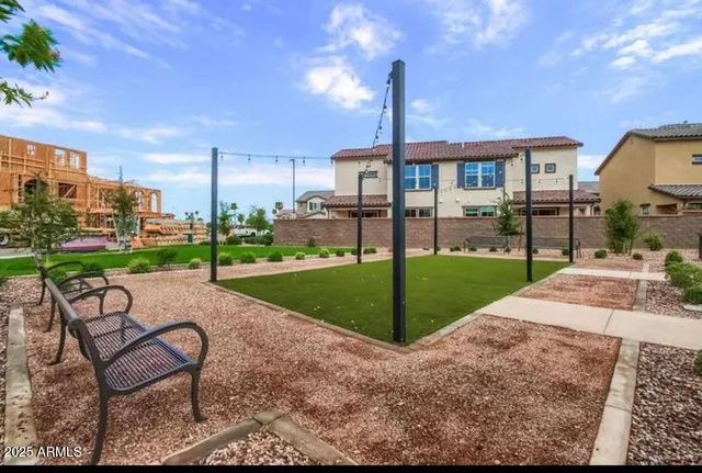a view of a house with backyard and a slide