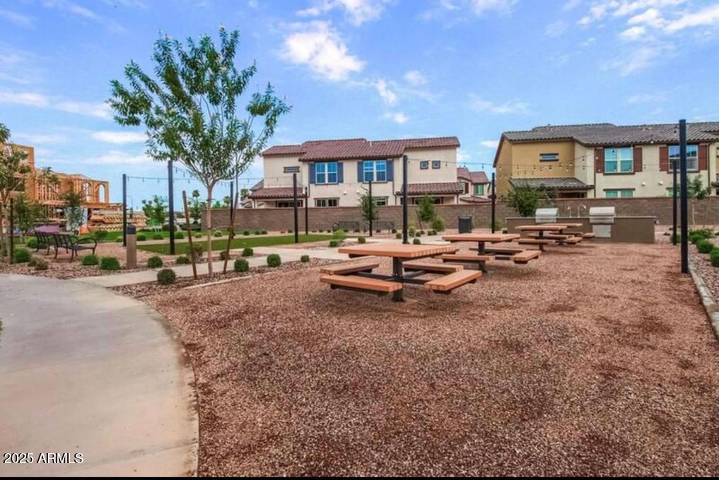 1255 North Arizona Avenue, Unit 1269 Chandler, AZ 85225 - Photo 20 of 29 a row of palm trees sitting in front of a building