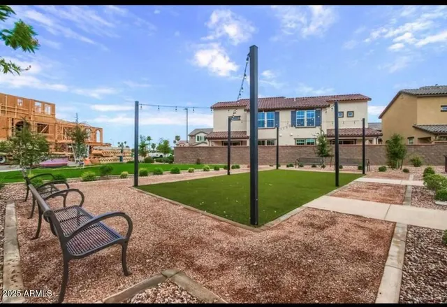 a view of a house with backyard and a slide