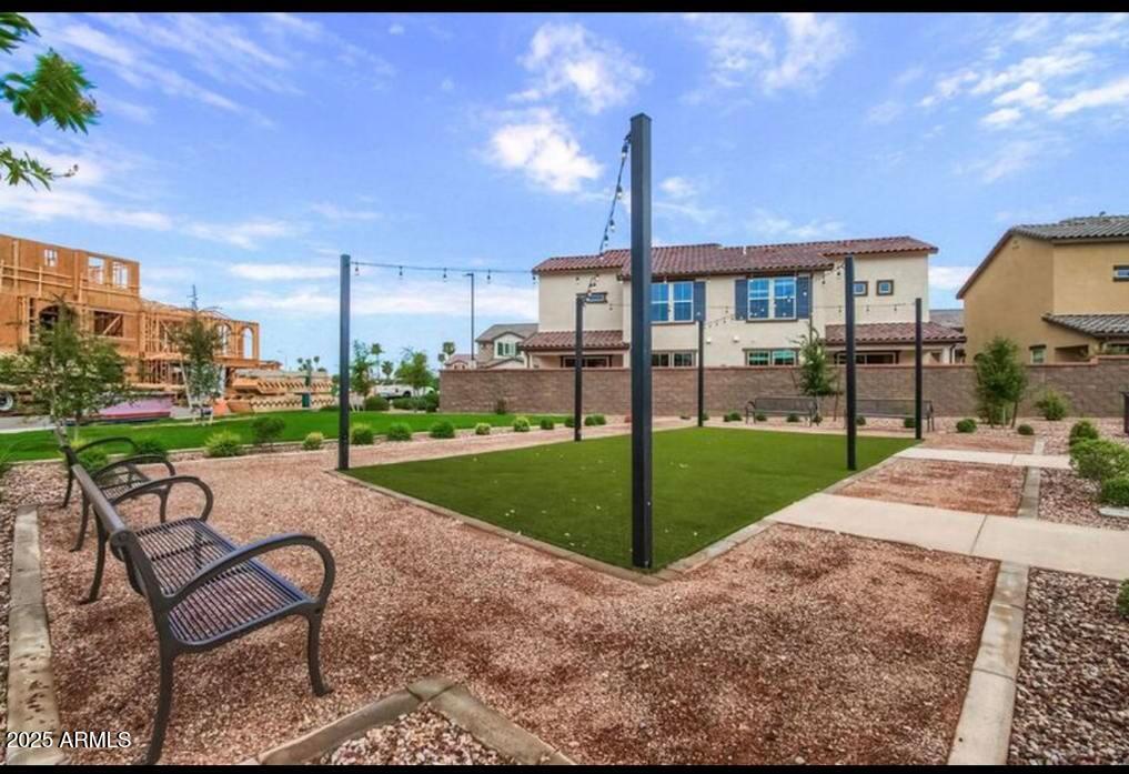 1255 North Arizona Avenue, Unit 1269 Chandler, AZ 85225 - Photo 21 of 29 a view of a house with backyard and a slide