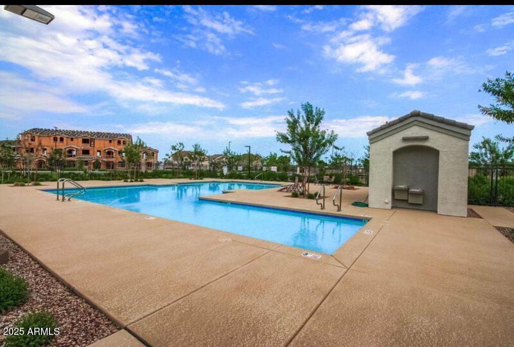 1255 North Arizona Avenue, Unit 1269 Chandler, AZ 85225 - Photo 27 of 29 a view of a house with a yard and a large tree