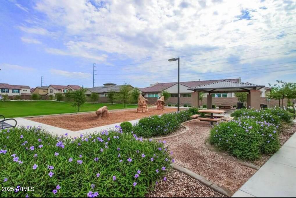 1255 North Arizona Avenue, Unit 1269 Chandler, AZ 85225 - Photo 28 of 29 a view of a garden with a table and chairs